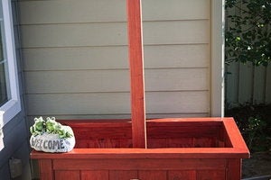 Garden box with pole for hanging baskets